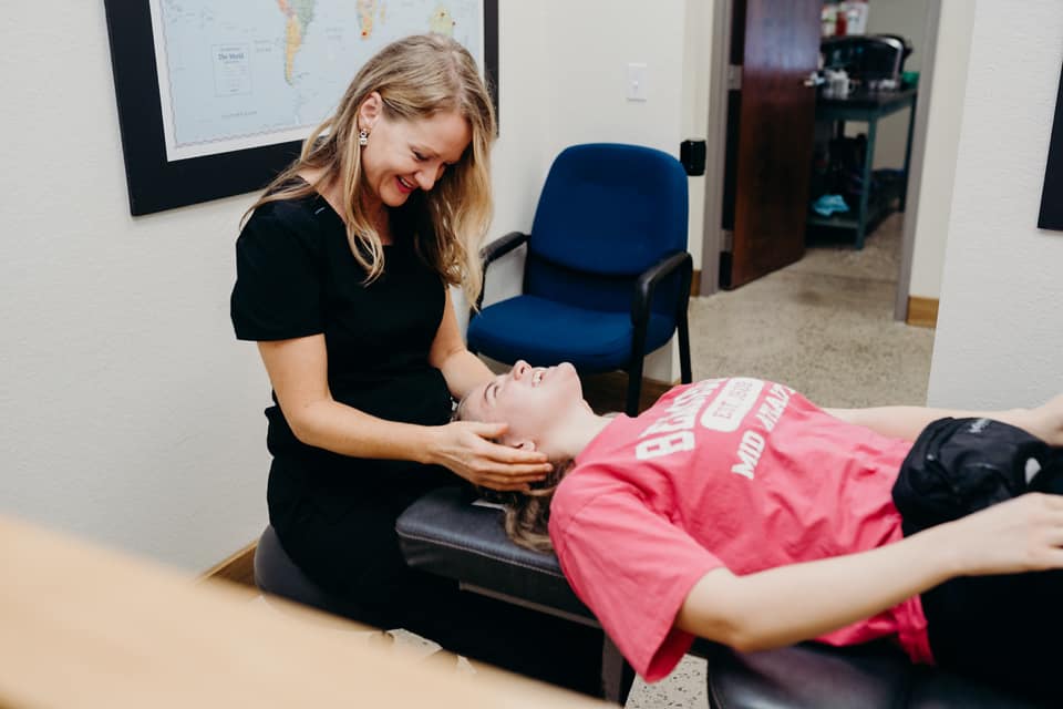 Doctor performing a procedure on a patient